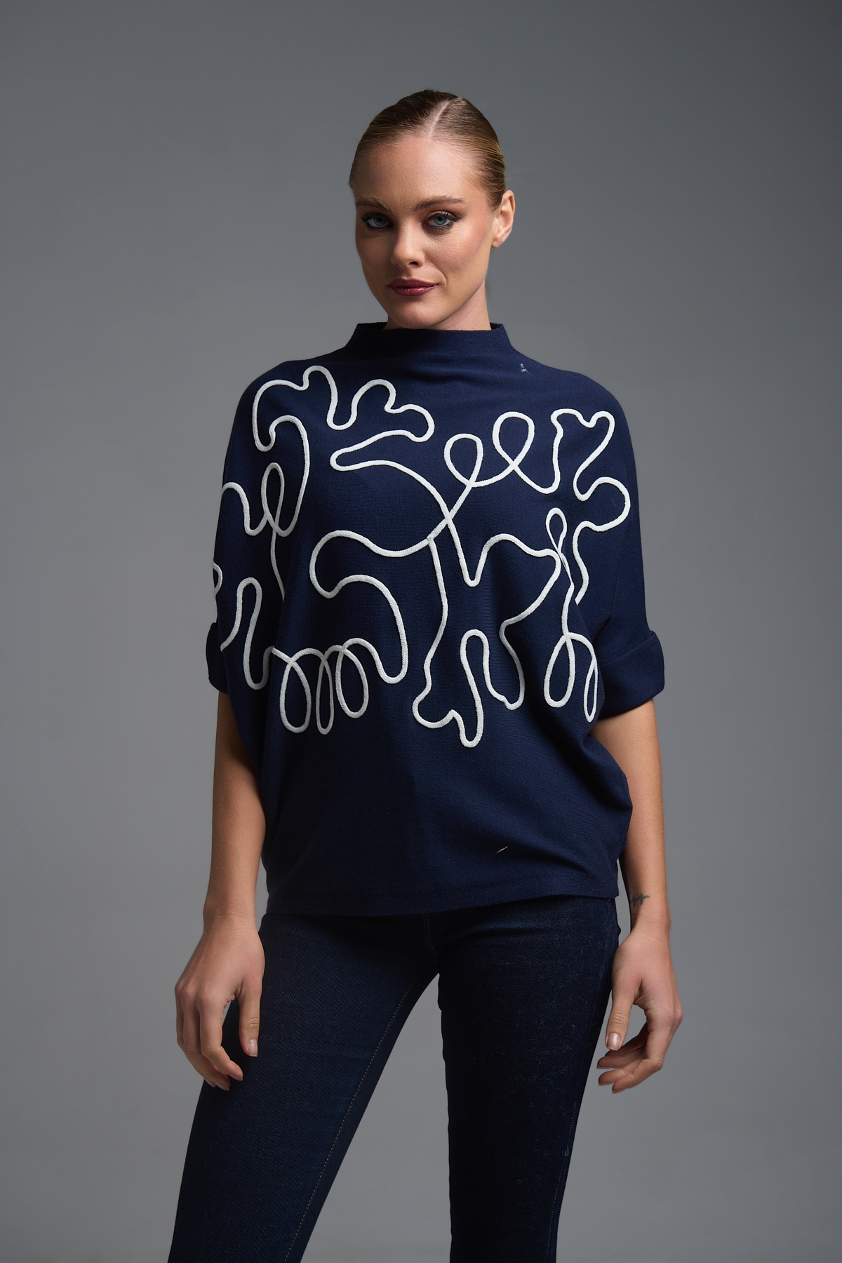 Oversized Knit Top with Artistic Line Embroidery