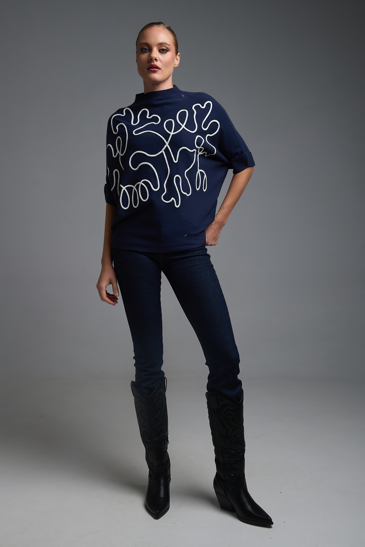 Oversized Knit Top with Artistic Line Embroidery