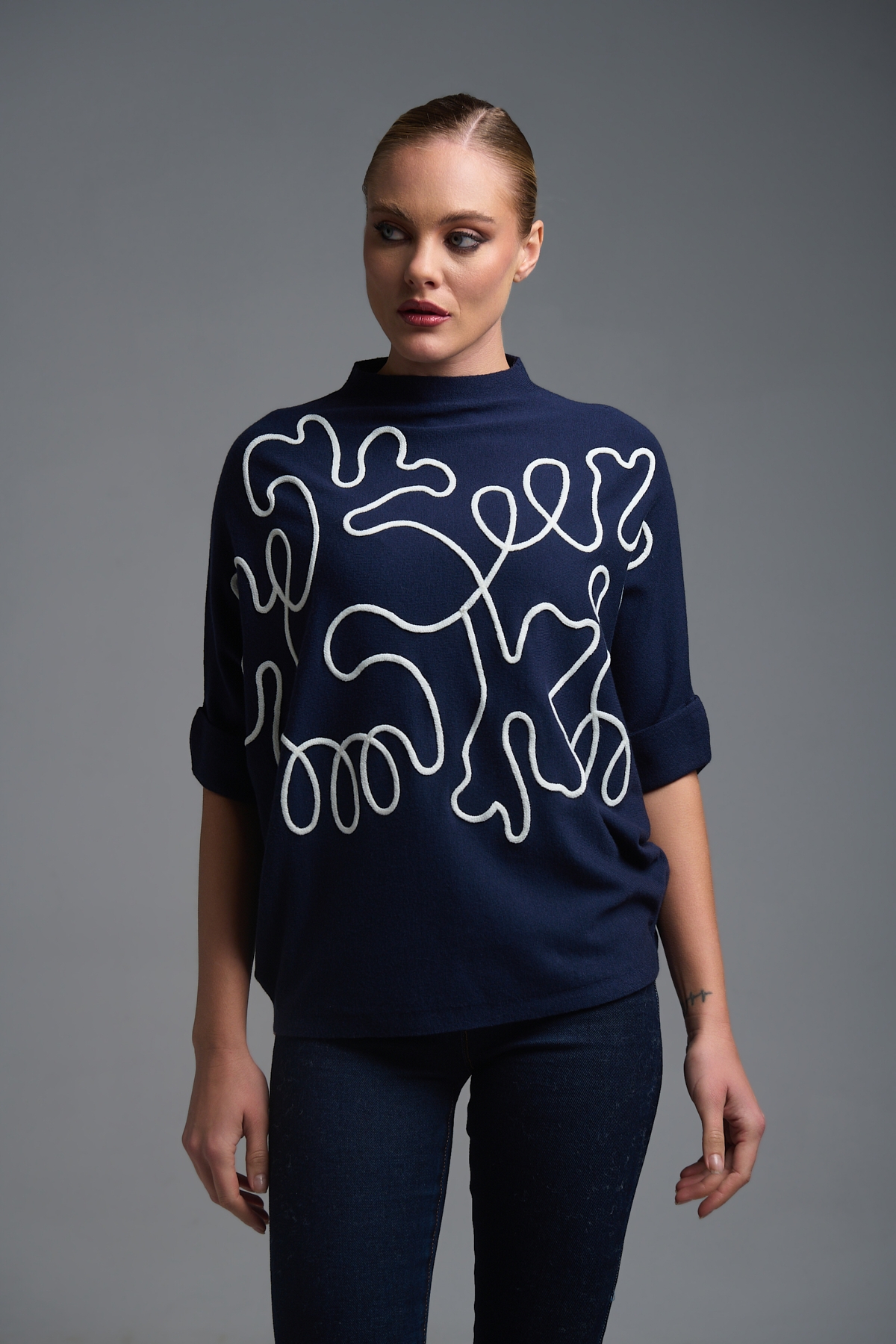 Oversized Knit Top with Artistic Line Embroidery